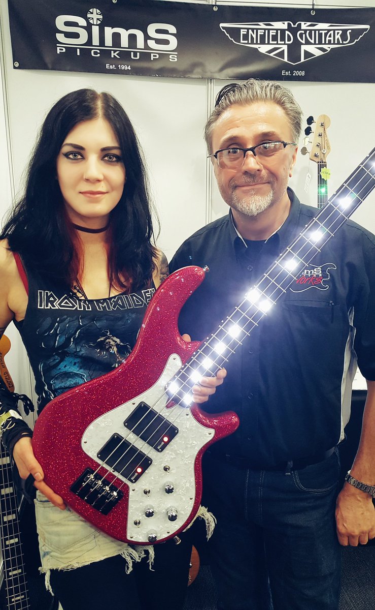 BeckyB_Bass's tweet photo. Favourite snap from @bassguitarshow with this shiny bass from @SimsGuitarWorks #bassguitar #simspickups #londonbassguitarshow #bass #bassist https://t.co/fEsS4gqaEl