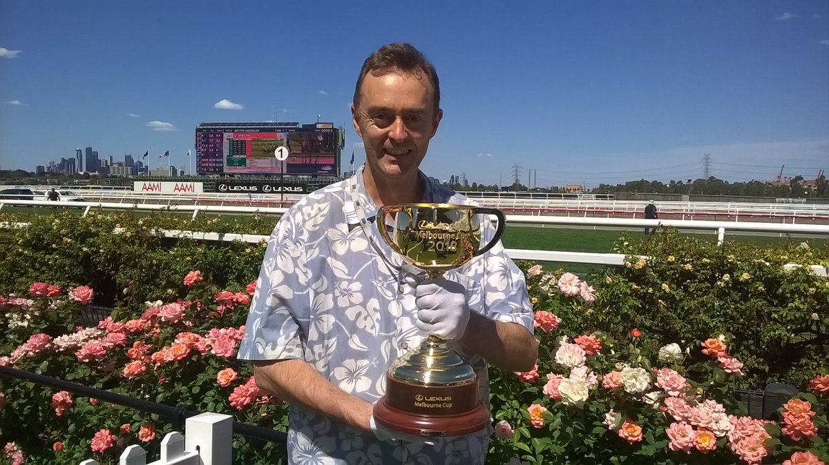 Posing with the 2018 Melbourne Cup. I'm the one wearing white gloves. NOTE: I didn't win the cup, I'm not a member of the horse family.