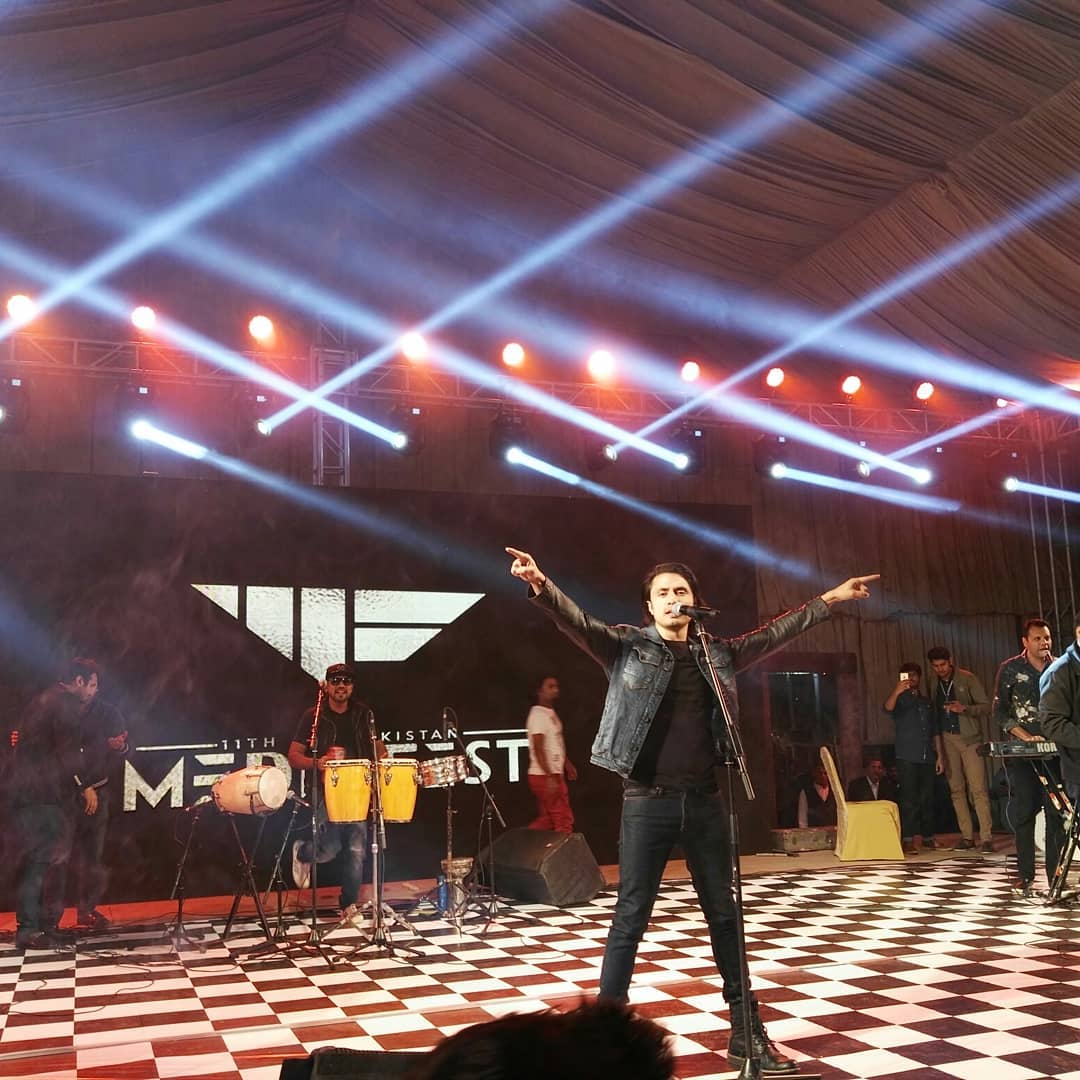 azianAfra_Alam's tweet photo. Our #Rockstar @AliZafarsays in full swing while a performing at 11th All Pakistan Media Fest held on 4th March
#EnergeticPerformer
#alizafar https://t.co/eGEMaqytuk