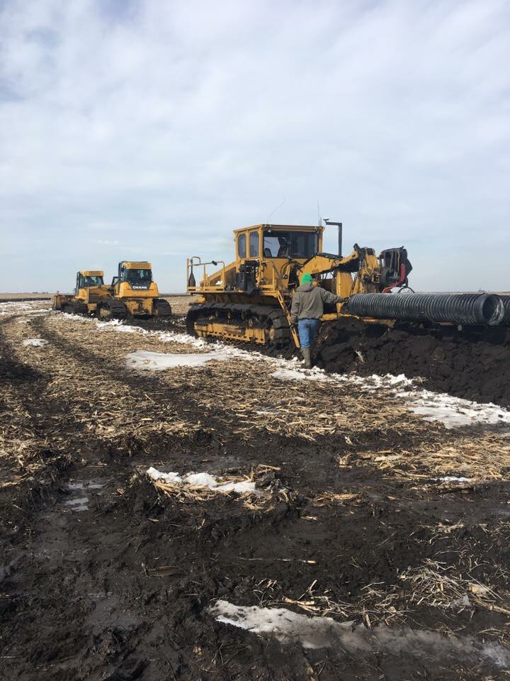 AGofTheWorld's tweet photo. Here is a look at the trench after the Bron plow goes through.  The plow is a much faster machine. We have special boots that will lay up to 18” tile. #BETiling18 @tilebride https://t.co/A7KqekBPPX