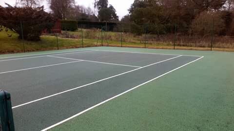 Today's tennis court which has been cleaned and treated for moss and algae.