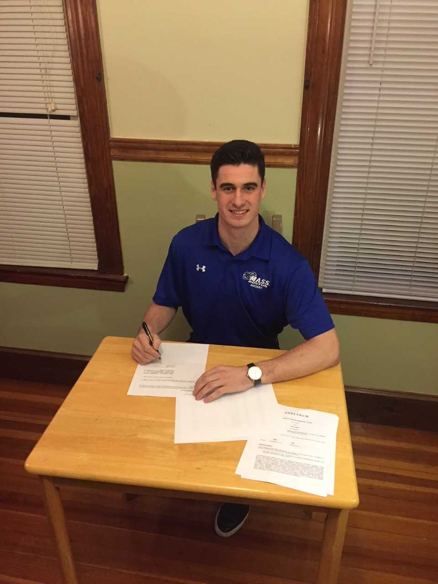 Colin Larkin signing his NHL hockey contract with the Edmonton Oilers