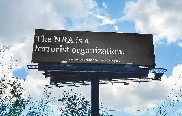 TomthunkitsMind's tweet photo. This is a real billboard that just went up in Pensacola, FL in the heart of gun country USA. https://t.co/smZN79qWAq