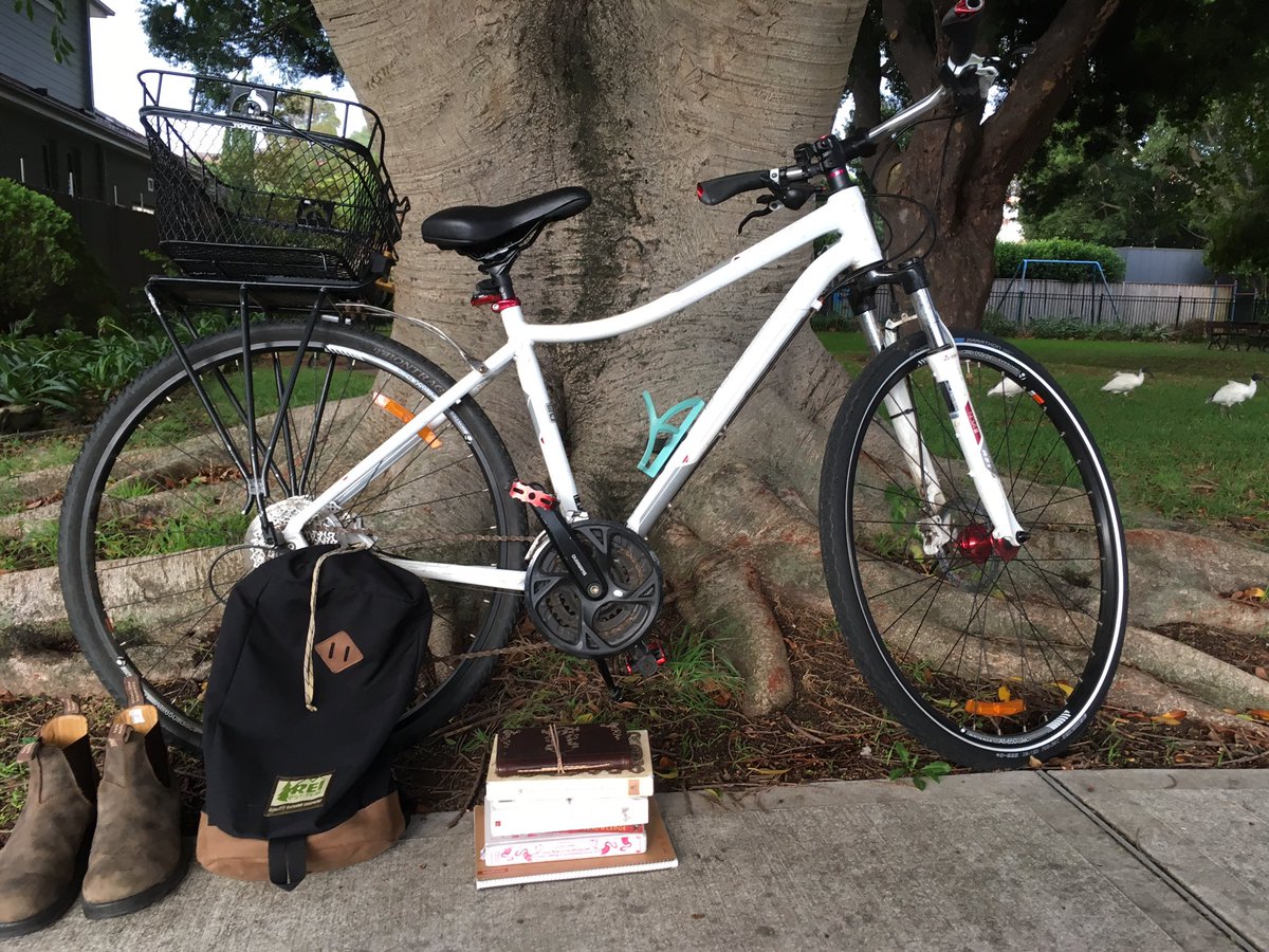 Unrulyimmigrant's tweet photo. Still life self portrait for @ARTS2093. Bicycle, boots, books, &amp; backpack ft. a family of bin chickens in the background. https://t.co/SJdUTxDWyM