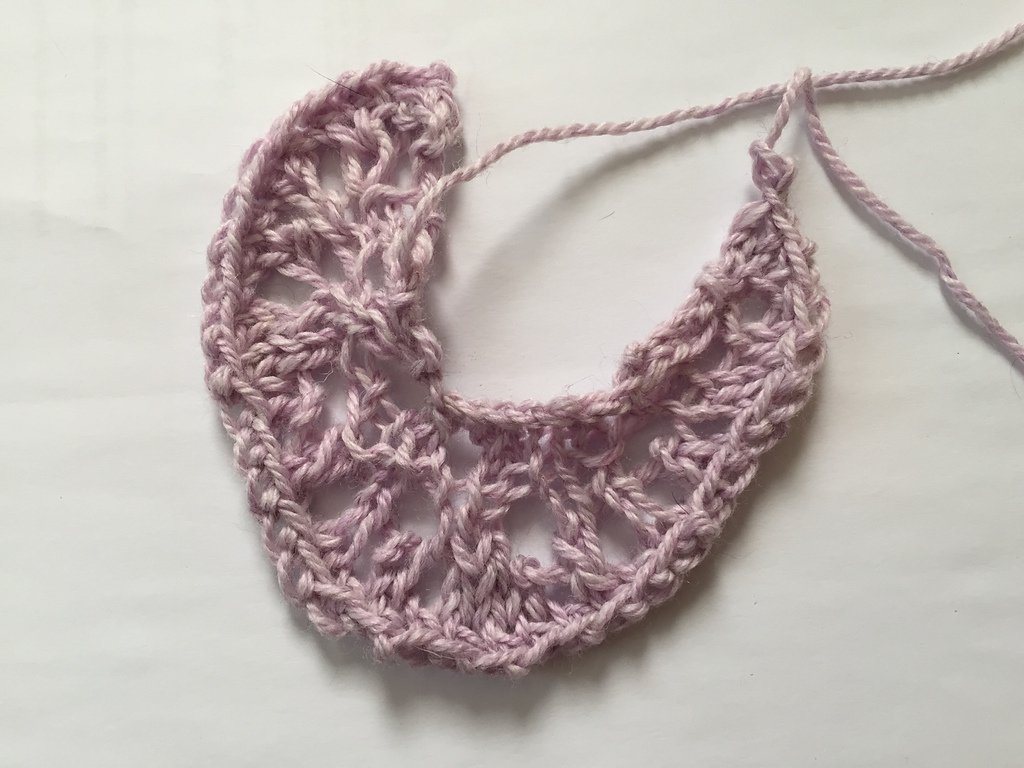 A small lacy pink curl.