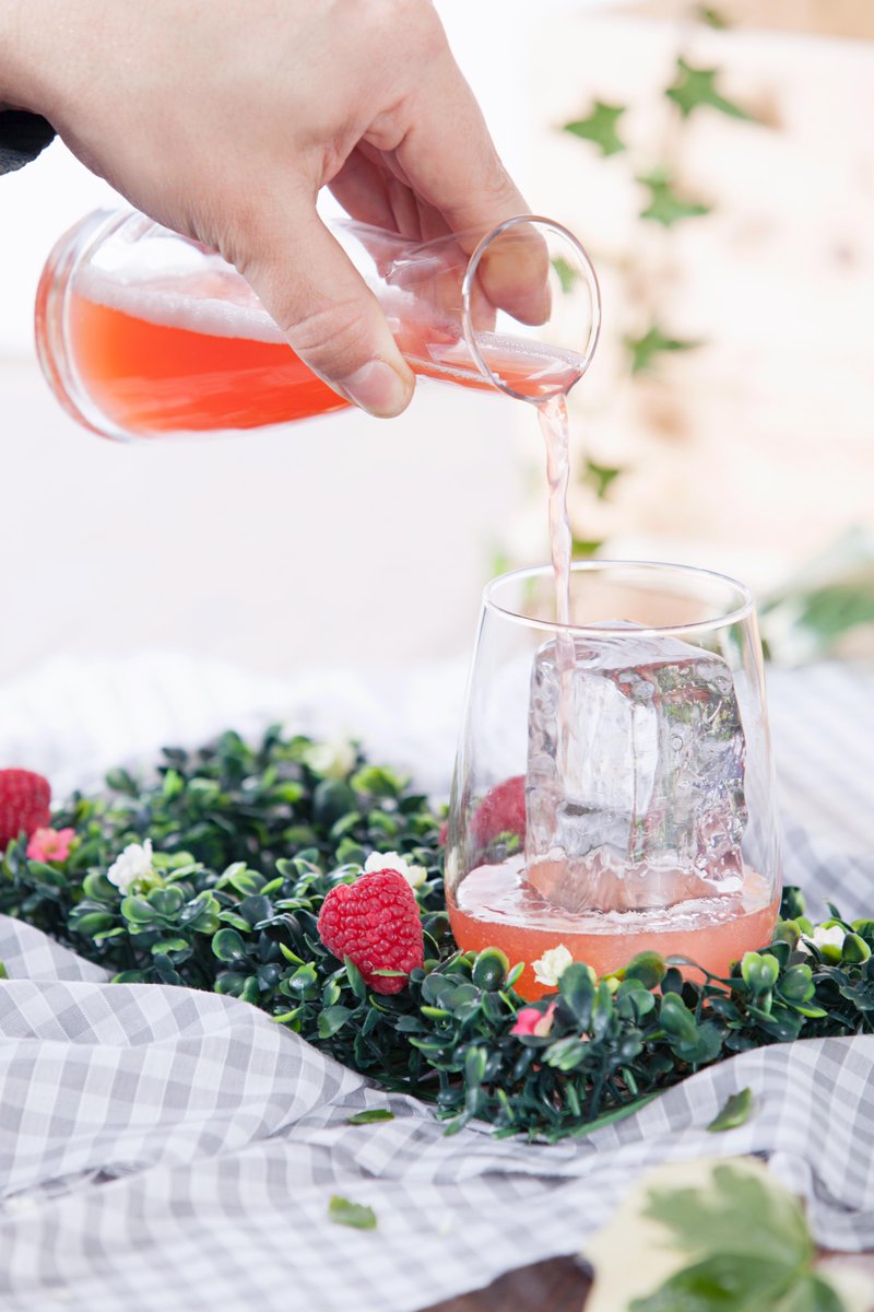 Raspberry Fields is of course served on a field of Raspberries. It is a mixture of Cocchi Rosso, Strawberry &amp; Sarsaparilla Shrub, apple juice and fresh lemon. 
#cocktails #leeds #bars #drinks #strawberries #raspberries