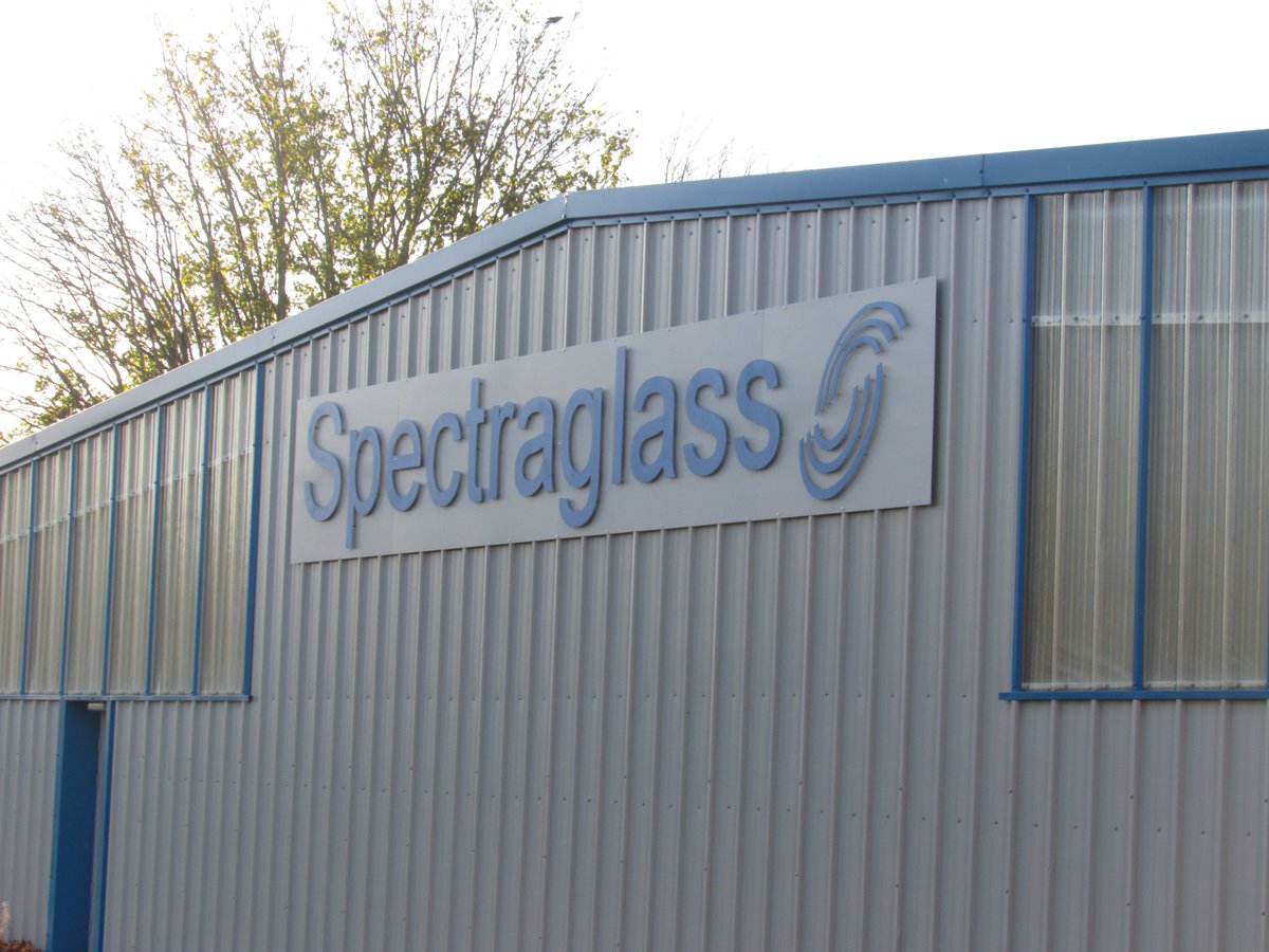 New sign goes on the factory extension