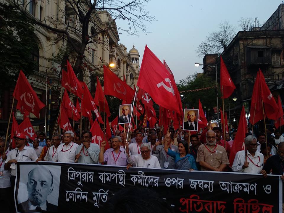 cpimspeak's tweet photo. Politburo Members March on the streets of Kolkata against the widespread violence launched by BJP-IPFT against our comrades in #Tripura. #StandByTripuraLeft 
#Lenin Lives! https://t.co/iDPr9NGKyj