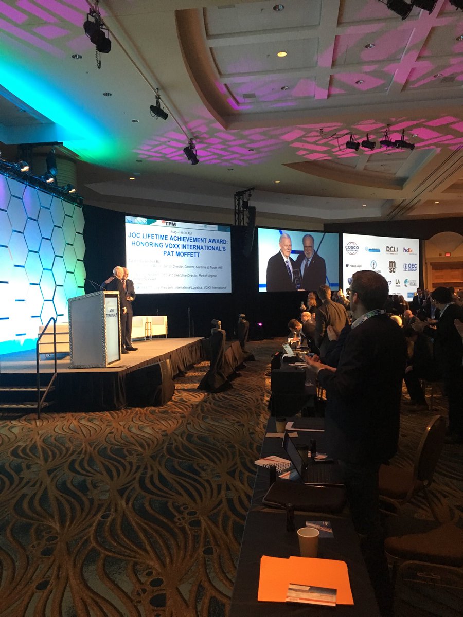 PeterTirschwell's tweet photo. Standing ovation for Pat Moffett of Voxx for his lifetime achievement award presented by John Reinhart of the @PortofVirginia #TPM2018. Congratulations Pat on a remarkable career! https://t.co/wkr4FN1wdB