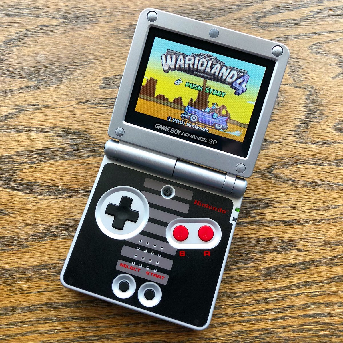 FiveJay's tweet photo. I finished fixing up my screenless #GBASP! Not only does this 3rd party screen look AWESOME, but this #ReplacementShell looks incredible as well! Really happy with how it turned out! Also, #WarioLand4 is super fun, wish #Nintendo would keep making these! https://t.co/rSiQ7AvahN