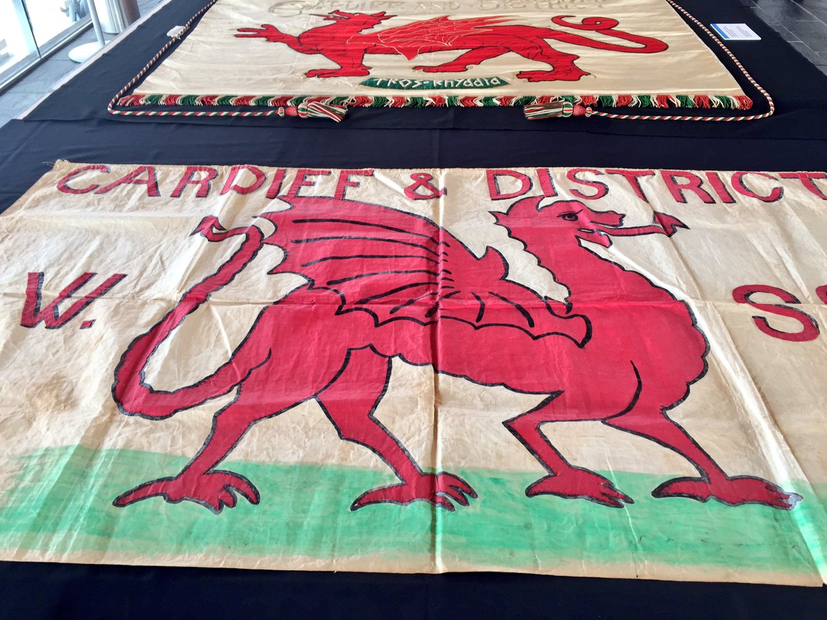 CuratorElen's tweet photo. One of those memorable days at the office. We had a fantastic time sharing and discussing our #suffrage collection at the Senedd today. What a setting to reunite the two Cardiff banners! #StillMarching #IWD #emotionalobjects #MakingHistory https://t.co/mHEk9JDcFn