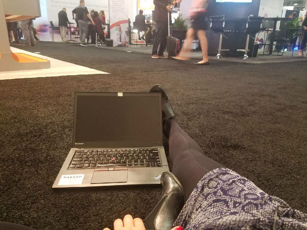 advizehealth's tweet photo. Where does an intrepid #HIMSS18 attendee go for a client call? The Expo Hall, of course! Taking a few moments to rest up after taking 20K steps in heels. #MoveSpring @Stridekick https://t.co/oNIbYIJ8yk