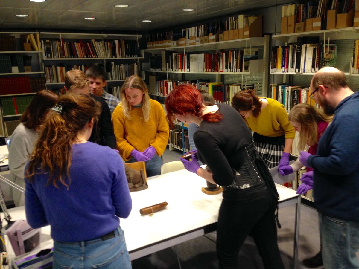 SainsburyRUnit's tweet photo. SRU MAs deciding on objects for the library display case #touristart #curateSRU #museum https://t.co/ndfLaZHb5I