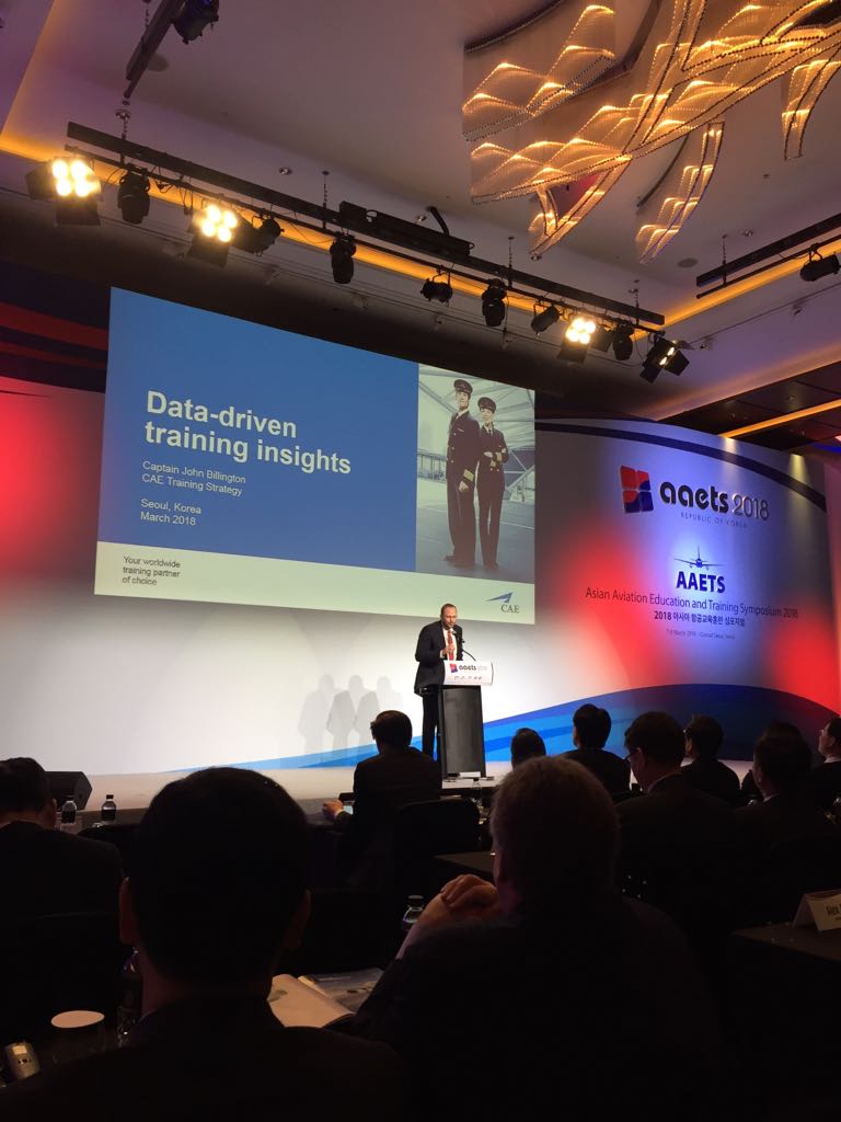 CAE_Inc's tweet photo. Captain Billington on stage at #AAETS sharing insights - The future of #pilot training is data-driven! 
Missed the conference? It's not too late to come visit us at booth 113! #AAETS18 #AAETS2018 #Seoul #trainwithCAE #avgeeks https://t.co/VtxLWgJZpj