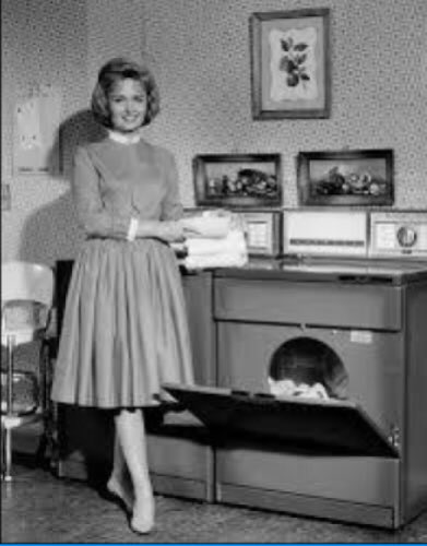 GenderActivists's tweet photo. PART TWO
In this photo Donna stands by her washing machine and dryer. She holds a pile of clothes while wearing a typical wifey dress. Her hair is done and she has heels on. This is an extremely sexist photo, and so is the show. https://t.co/kD9iIaVbTl