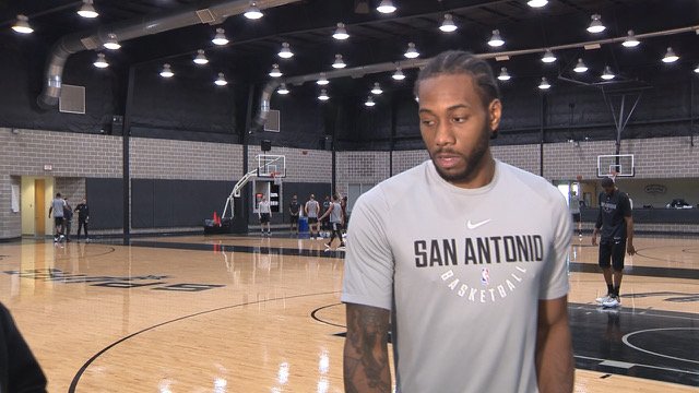 KSATRJ's tweet photo. BREAKING #Spurs news: Kawhi Leonard addressed the media today and said he would want to finish his career in San Antonio, adds he will return "soon" and he is practicing with physical contact, goal is still to return this year (pics via @markmendez) #KSATsports #GoSpursGo https://t.co/dxqCduvlsU