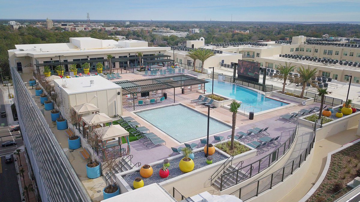Nothing says luxury quite like the rooftop pool at The Standard in Gainesville, FL.  Constructed with precast concrete, this amenity level parking deck makes the most of vertical space by integrating parking with amenities such as retail on the ground level and a rooftop pool.