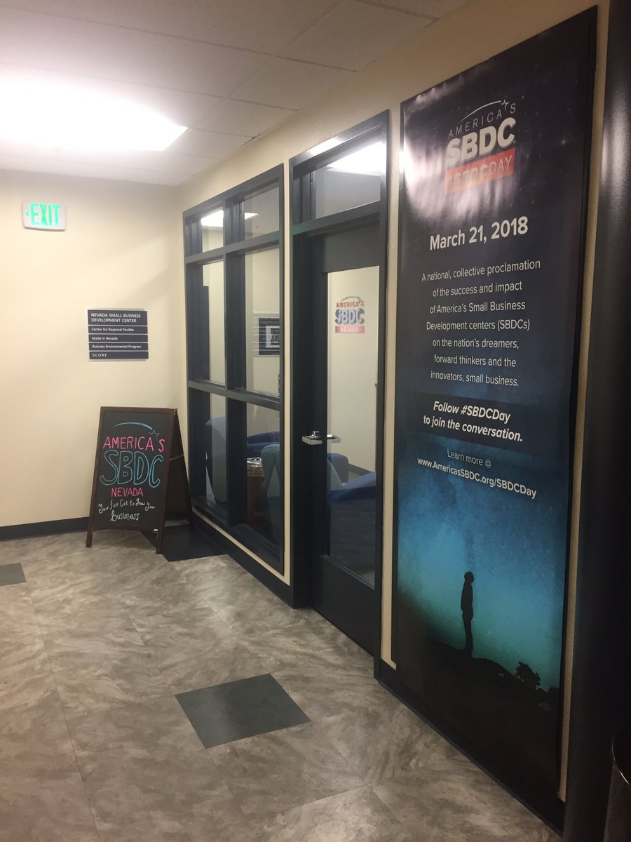 NevadaSBDC's tweet photo. How many SBDC logos can you spot in this picture? We are excited to be hanging our #SBDCDay poster outside our office. Only two weeks away from National SBDC day! #NSBDC https://t.co/Ts4A3sGIoN