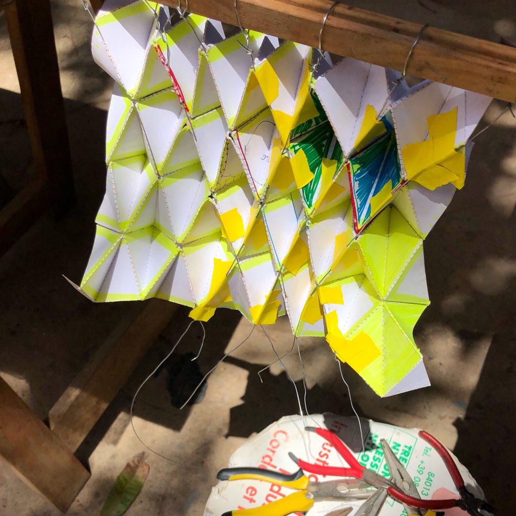panurban's tweet photo. Making progress on our end! The #Spacecraft #origami-#kente-style soft and kinetic 3D envelope low-fi prototypes with the help of wonderful women from the neighboring sewing school @xamxam_org @sociarchi @africanurbanism @dkoa @qampnet  @kerthiossane https://t.co/b2gV71o036