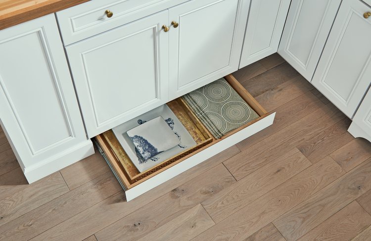WWSinc's tweet photo. Have placemats you only bring out once a year? Cookie sheets? Pizza Stone, from when everyone was giving stones as gifts? If it's flat, it'll fit in your new hidden toe kick drawer by KraftMaid Cabinetry! https://t.co/1wNwPSnfdz