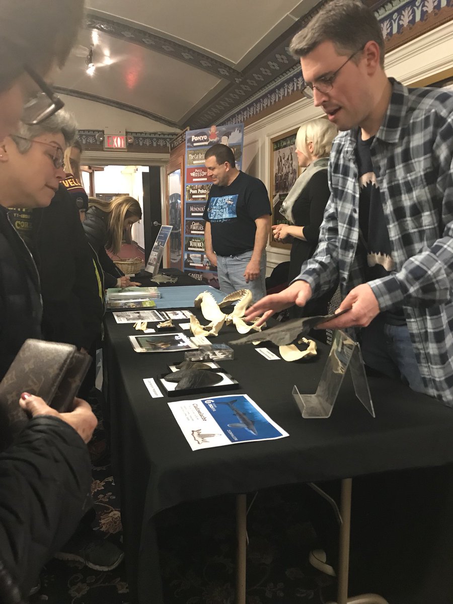goCMNH's tweet image. Paleontologists Lee Hall @paleeoguy and Ashley Hall @LadyNaturalist talking with movie-goers about #fossil sharks (including local fossils found in the #Cleveland shale!) before tonight’s 7pm #REELscience screening of #Jaws at @CedarLeeTheatre.