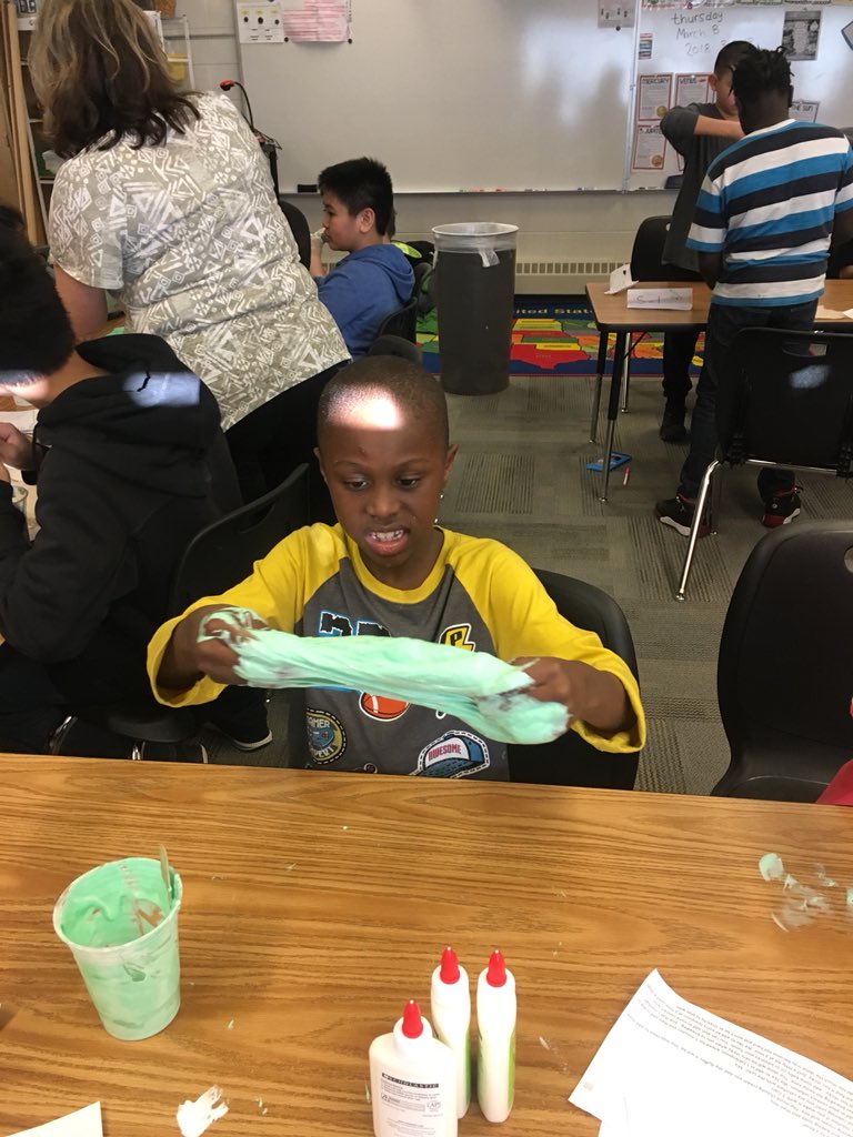 Making slime.  Did you know slime is a polymer?  That’s what these kids are learning.