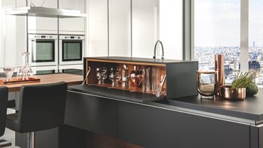 Designer storage unit with cognac-coloured interior that matches the kitchen as part of our Capital Elegance line. Just beautiful isn't it?! #KitchenShowroom #SchmidtKitchens #SchmidtDorking #Surrey #Dorking #KitchenDesign #Kitchen