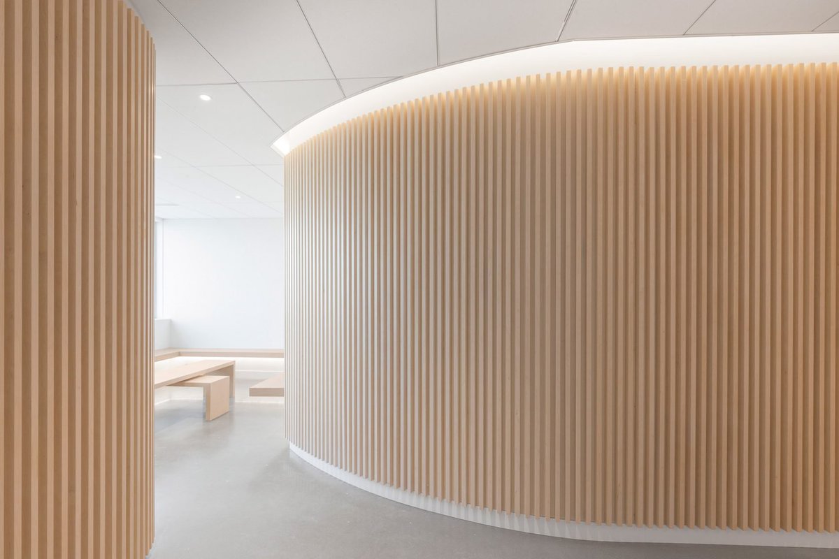 oartgroup's tweet photo. Slatted wood panels and ambient lighting are intended to make visitors feel more at ease at this orthodontist practice in Canada, by designer Natasha Thorpe. https://t.co/Xren34dza6
