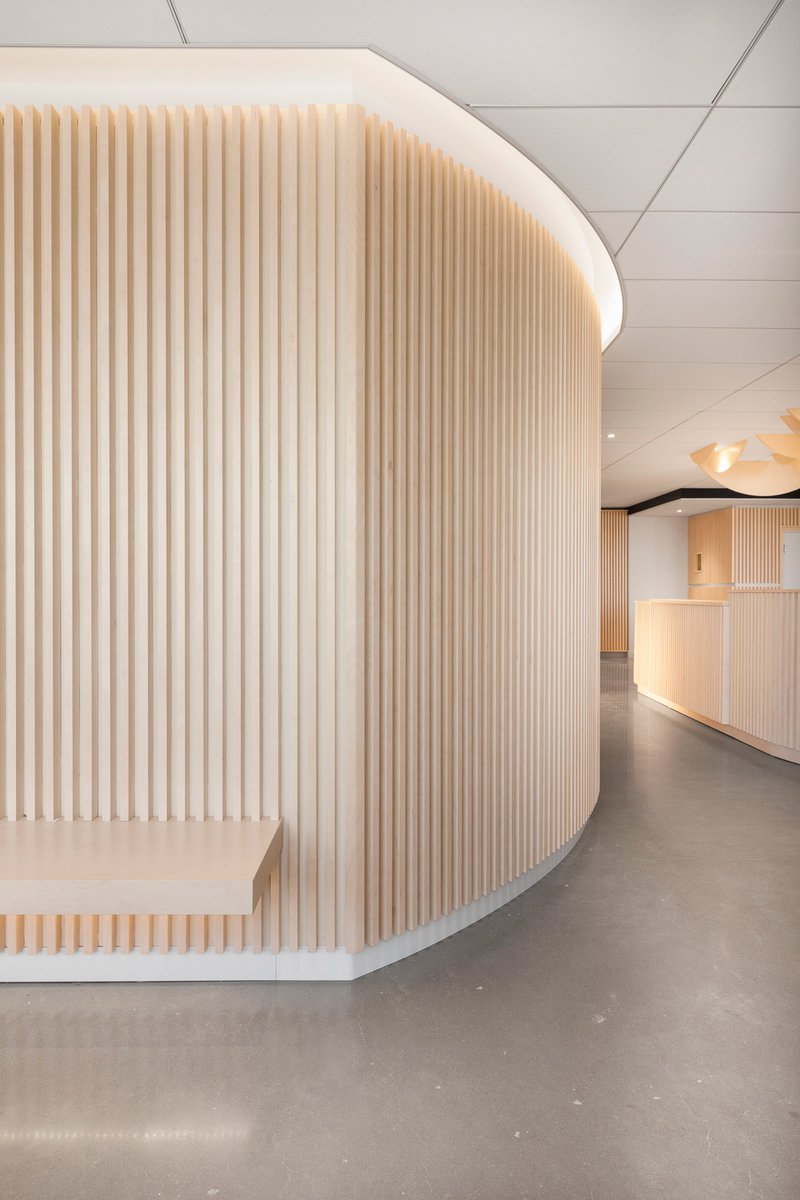 oartgroup's tweet photo. Slatted wood panels and ambient lighting are intended to make visitors feel more at ease at this orthodontist practice in Canada, by designer Natasha Thorpe. https://t.co/Xren34dza6