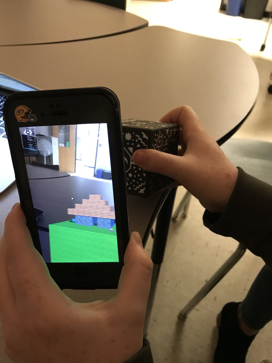 BryanDoppel's tweet photo. JD played around with my new #MergeCube and built a house in 5 minutes! Thanks for this cool new gadget, @GRAETCorg! #EdTechRVA2018 https://t.co/CxnPOQpQTr
