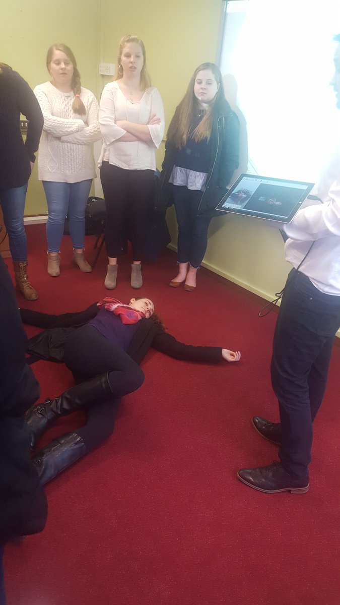 KeeleGlobalEd's tweet image. Ball State and UNCW students enjoying a talk on Forensics, with one of them playing dead to demonstrate the body scanner