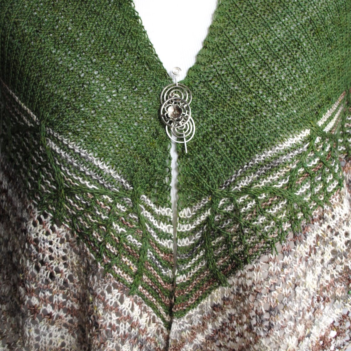 As Seen in the #STITCHESWest Fashion show! Pattern and pin from <a href="/CraftyFlutterby/">Crafty Flutterby</a> Yarn available from <a href="/DestinationYarn/">DestinationYarn</a> #knit #shawlknitting #shawlpin #ravelry #yarn #yarnlove
