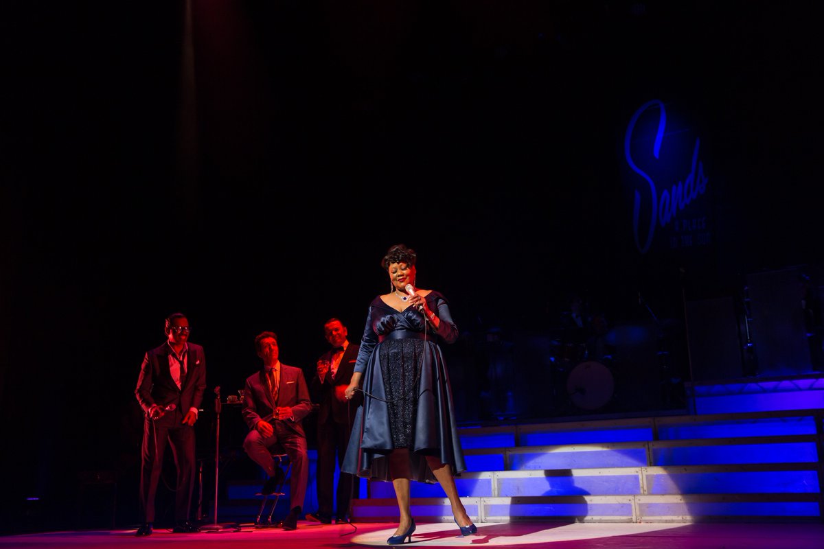 RatPack_Live's tweet photo. @SundEmpire the Burellis and the fabulous Ella Fitzgerald are on their way!

Drift back in time and join us in re-imagining a night at the Sands, it’ll be a party, and all are welcome. Spread the word! 💃🏼🎙️

⏰ Next Week
🎟️ https://t.co/LU1qdiR54i

(the Boys, too ... ) https://t.co/1bvptSmMFk
