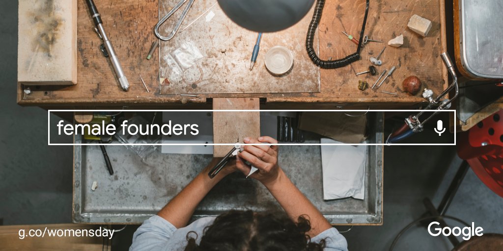 Overhead photo of a work bench with various tools and a woman's hands. A search bar over the photo with the query: "female founders."