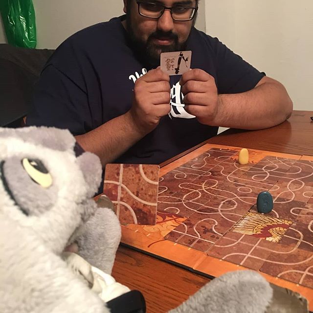 TheMightyPsi's tweet photo. What was Geoffrey T. Goat up to this week? Geoffrey and Haley Nelson played a game of Tsuro against Sukhi Bassi (it's a pretty interesting puzzle game). Sukhi was a tricky opponent, but Geoffrey was a natural puzzle master and they were able to beat him! https://t.co/2mOG76Mi7I