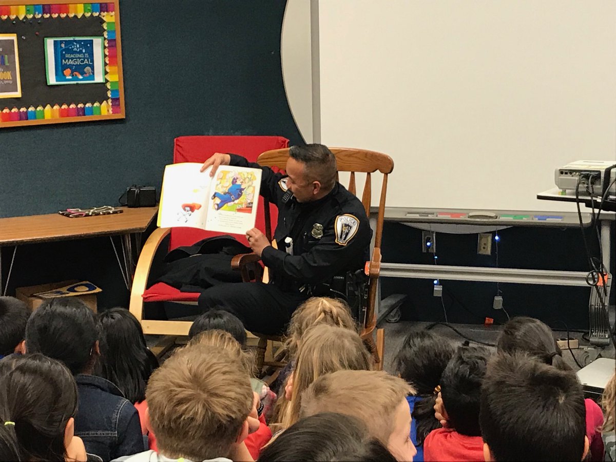 cdospil's tweet photo. Officer John reading to the fourth grader. @HamiltonHawks82 #OneTROY https://t.co/AyVwol5xgE