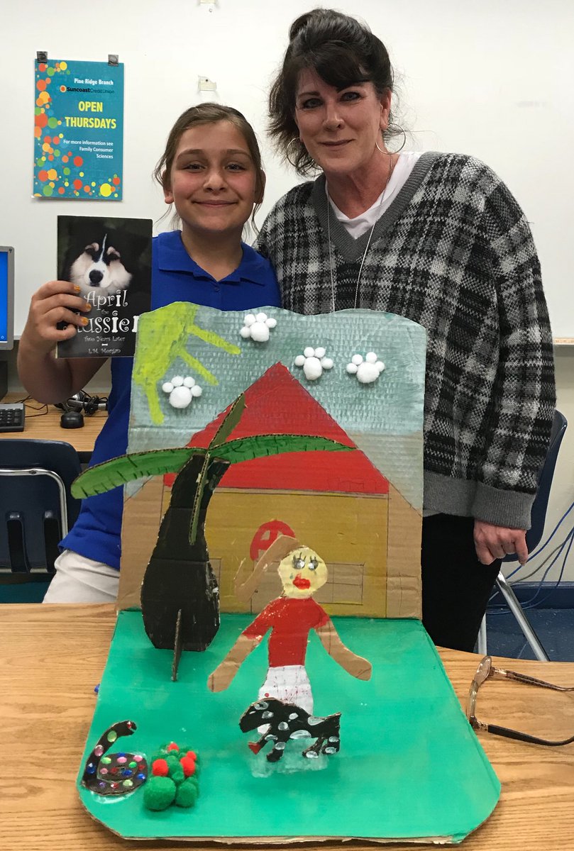 Read4Lyfe's tweet photo. Author is in the House!!! Bella's 3D book project (look at her attention to detail - April’s red paw where the snake 🐍 bit her) on April the Aussie, written by Lynn Morgan (pictured) @CCPS_SecELA @PRMPanthers https://t.co/PSYliUIcTQ