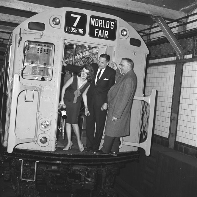 NYTransitMuseum's tweet image. This #NYTMCollection image depicting passengers on an R36 subway car bound for the World’s Fair was taken in 1964. @NYMets fans can take our #TrainofManyColors, made up of R33/R36 cars, to the Met’s #HomeOpener on March 29th. Find out how at facebook.com/nytransitmuseum