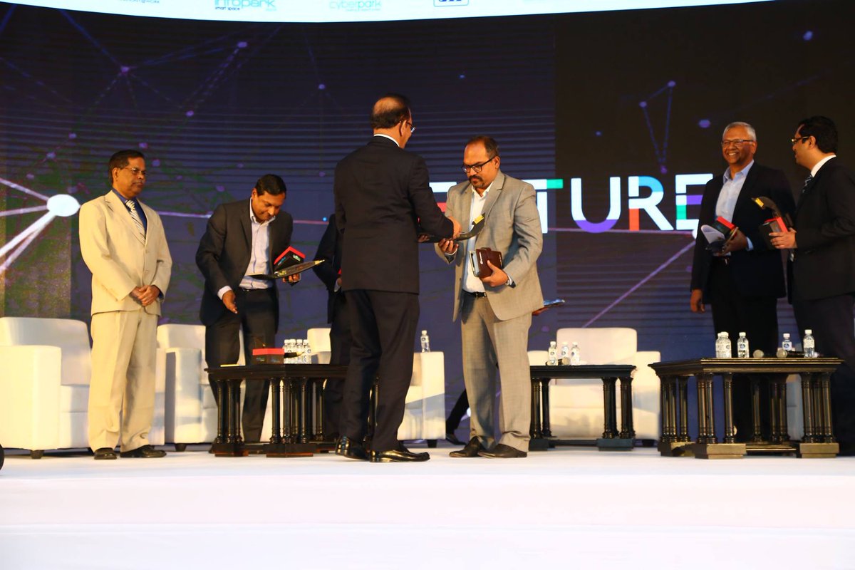 OfficialTADF's tweet photo. Shri V.K. Mathews, Founder &amp; executive chairman, IBS, honoring the panelists. #Future https://t.co/4WgFph4D19
