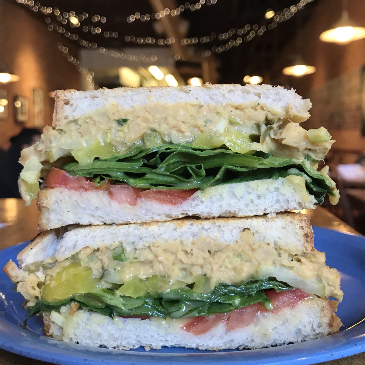 GrumpysDeli's tweet photo. Have you checked out our #vegan specials?!?! Who knew chickpeas could be prepared to taste so much like tuna fish! This custom grilled creation is our mock tuna on sour dough with spinach, tomato, pickle, banana peppers and honey-cup mustard🤤 https://t.co/LOuYpUK9Yq