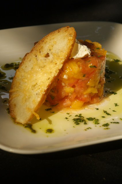 A veggie favorite- our Tomato Tartare. Beefsteak tomatoes, shallot, tarragon, capers, ricotta cheese parmesan crouton, doc umbra olive oil