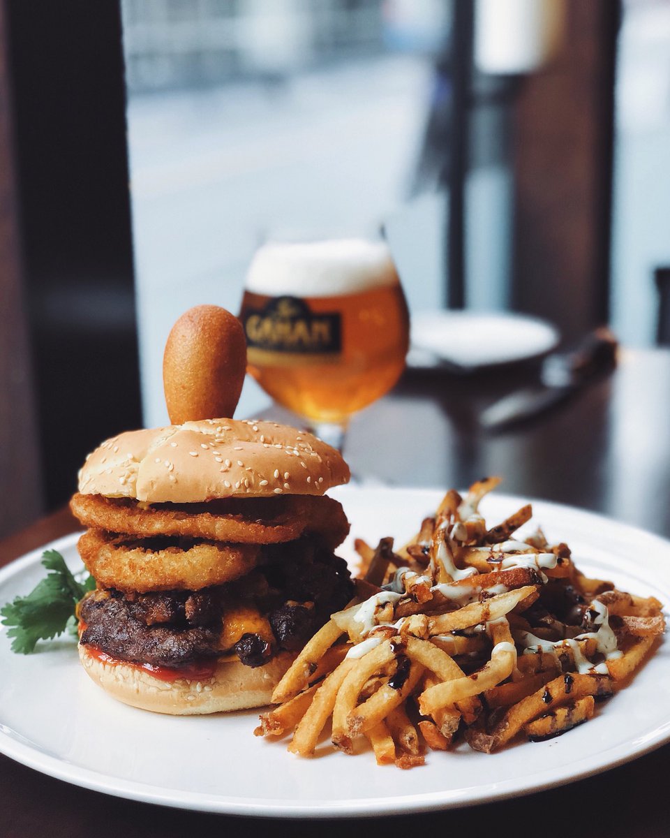 Halifax Burger Week starts TOMORROW! 🍔🎉

The Carnival Burger: Atlantic beef patty topped with ketchup, mustard, cheese, onion rings, chili, and a pogo - just like you got at the carnival. Served on a sesame bun with your choice of side.