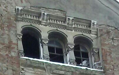 Roby_LS's tweet photo. Saw this building on my way to the piață .. I felt like looking up &amp; felt a presence from this top window. #spooky #creepy #Romania https://t.co/c4X3Tppd6D