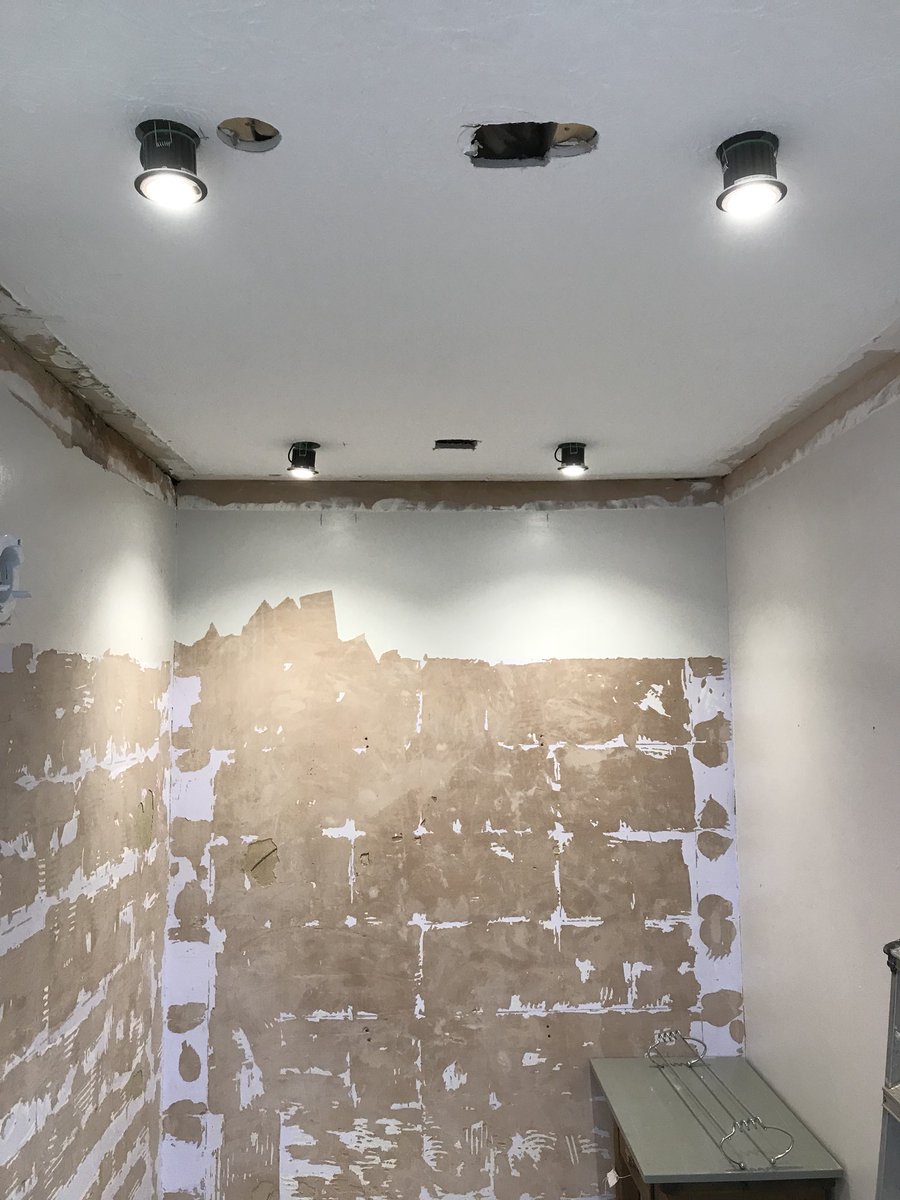 Bathroom ripped out, carcassed and now being tiled