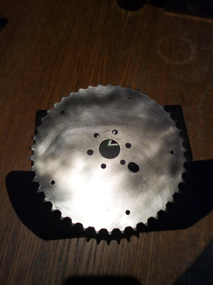 Using an extension bar, a  socket and a warped brake disc to drill PCD to bolt sprocket to hub. This would have been much easier with a mill + DRO /  laser cut sprocket but this one was free! Turned out ok given the sketchy method. <a href="/Stealth_Racing/">Nathaniel Olson</a> <a href="/SahalAutomotive/">Sahal</a> <a href="/DresselRacing/">Dressel Racing</a>