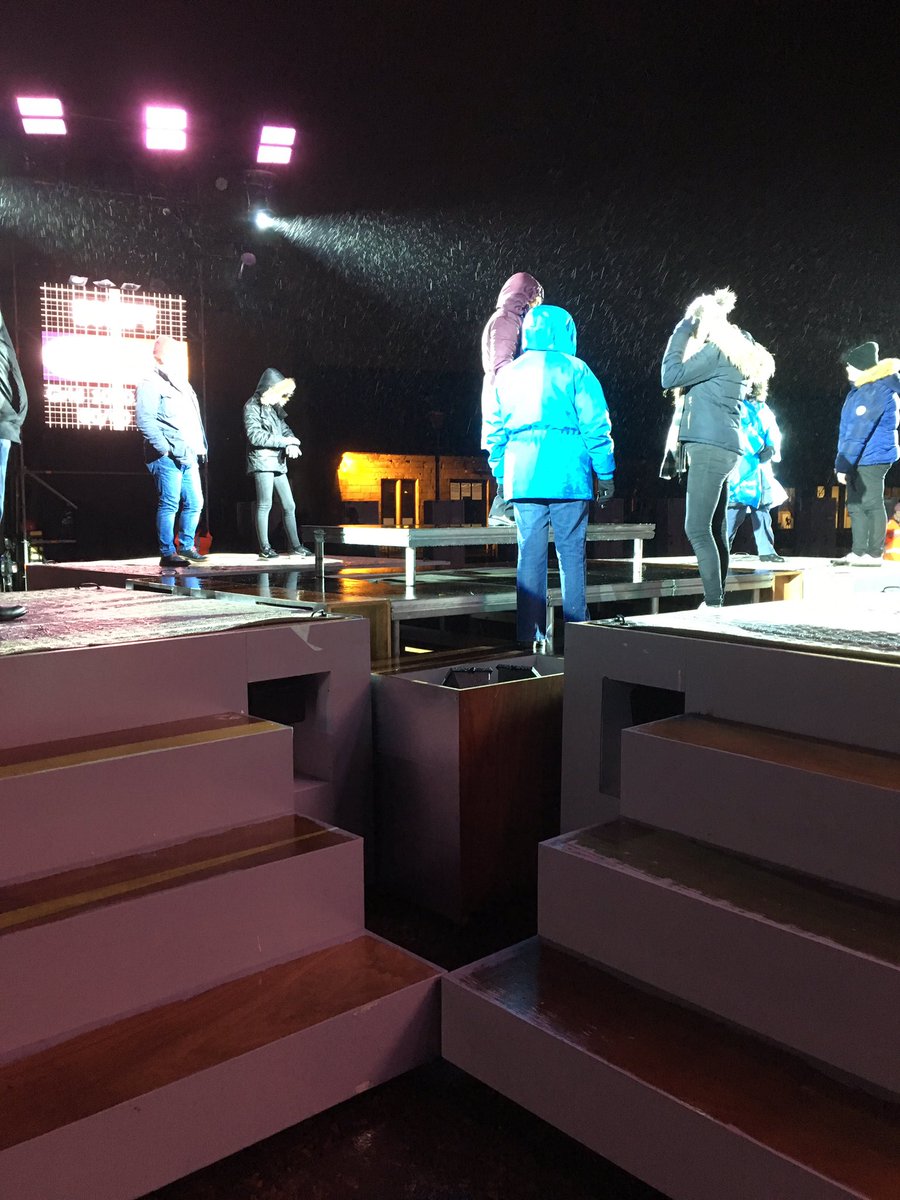 TNS_Simon's tweet photo. #NL Shift cast rehearsing in the rain. Proper shift tonight.  Getting very exciting. Love this bunch of people telling their own stories and breaking all weathers to do so. #lovemyjob https://t.co/m35wij6Ku0