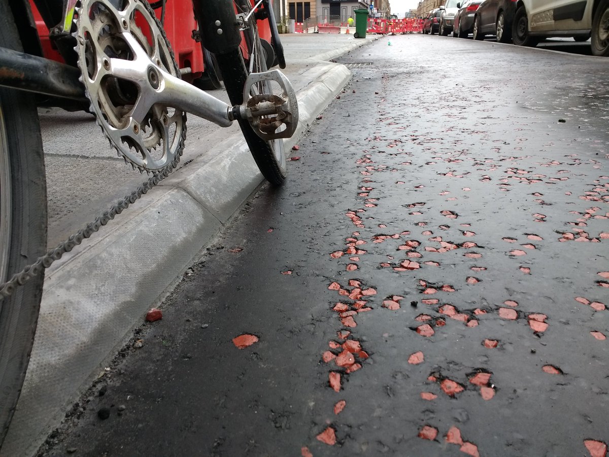 PlanforBikes's tweet photo. Fabulous to see the progress with Glasgow's South City Way on my commute. Well rolled surface, low chamfered kerb = good pedal clearance to maximise width, generous angles and, of course, it will be uni-directional. #stepchange in street design in Scotland https://t.co/7nXrnuWAxh