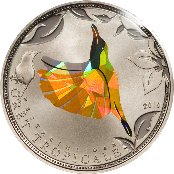 Egina_Coins's tweet photo. This colored copper-nickel #coin from the Prism collection represents a beautiful yellow #Sunbird. Most sunbirds feed mostly on nectar, but can also eat spiders and insects. https://t.co/dpQe6AaKEt #prismtechnology #wildelife #birds #sunbirds #collectible https://t.co/nwFsg9GOuW