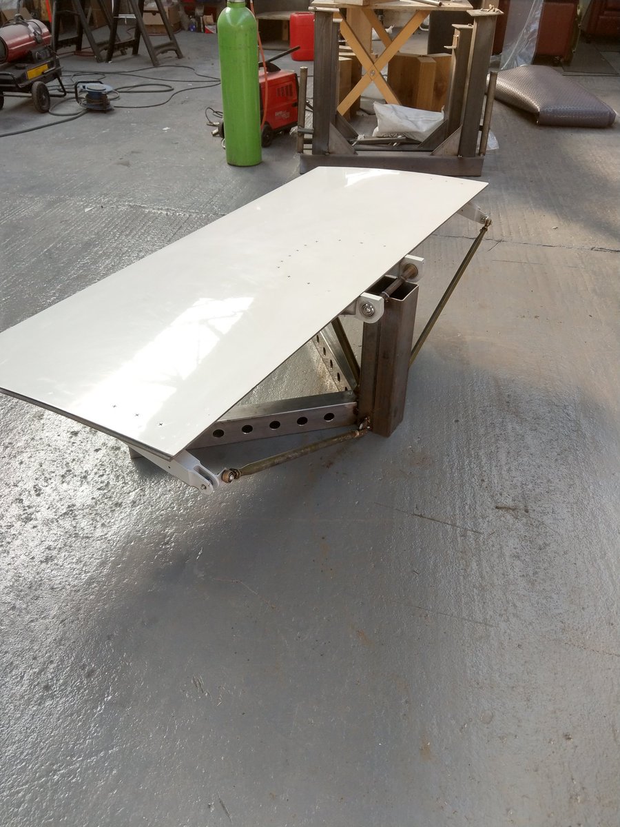 Stu_artaviation's tweet photo. Another new piece available! Airbus A320 spoiler table. Just got to smooth out the welds before the frame goes for it's powdercoat finish. Will have battery powered LED lights in the frame for that extra nice touch. #tableporn #avgeek #aircraftfurniture #bestineurope #brand https://t.co/ZeJ5W6UThk