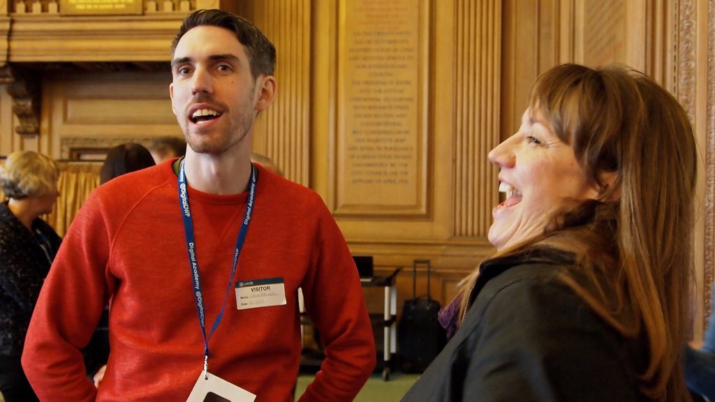 2 students laughing at the Academy community day